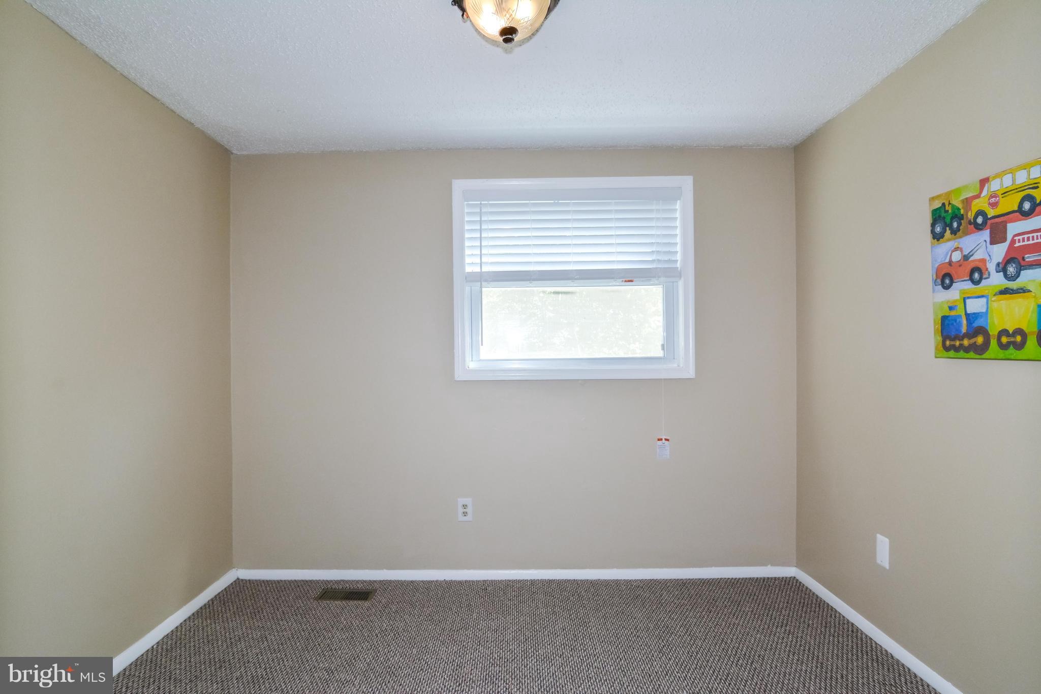 8609 Spring Creek Court Springfield, VA 22153 - Photo 11 of 30 an empty room with a window
