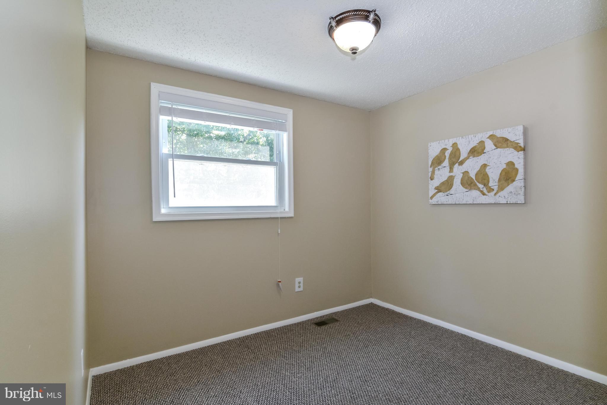 8609 Spring Creek Court Springfield, VA 22153 - Photo 13 of 30 an empty room with a window