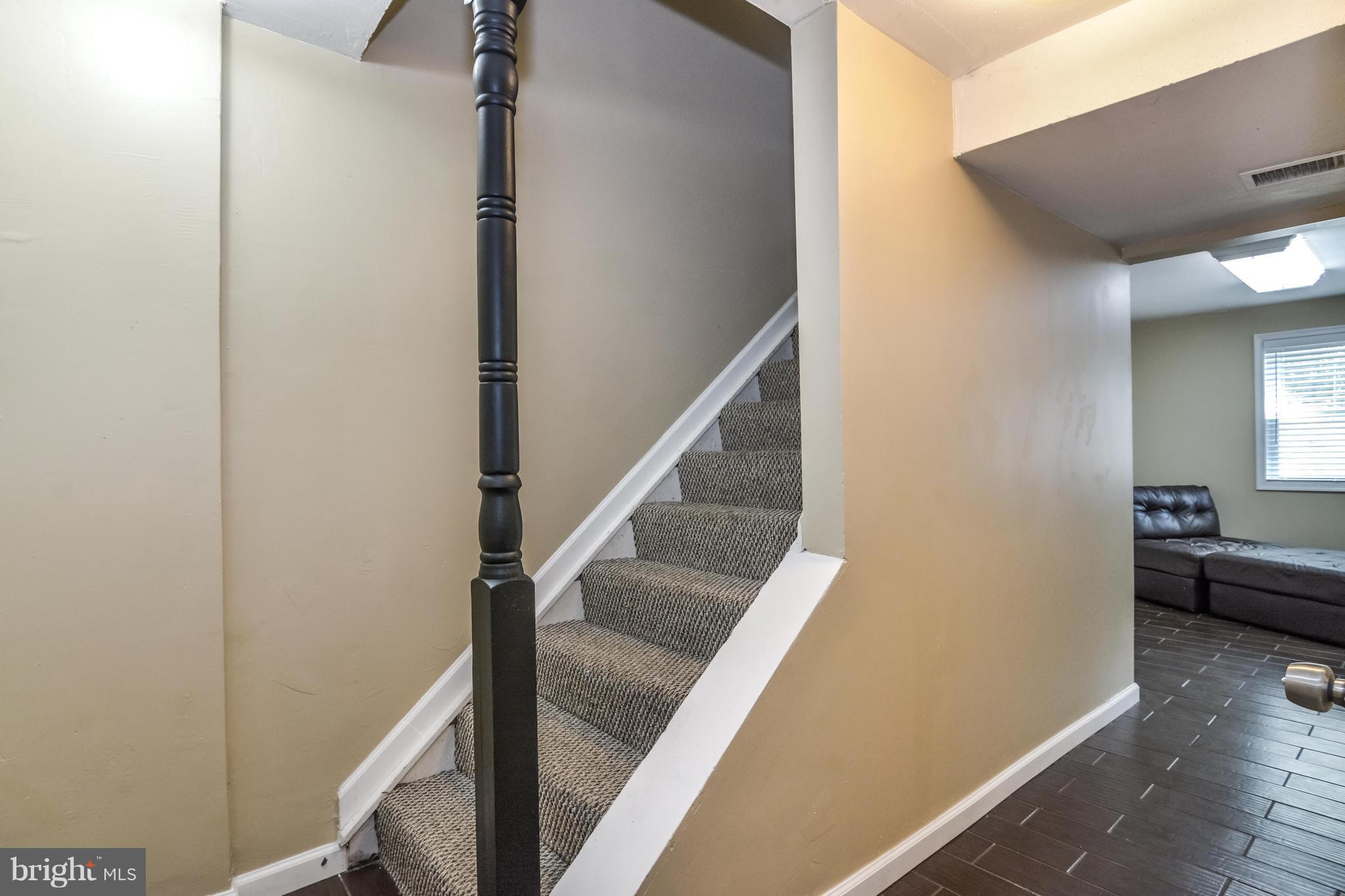 8609 Spring Creek Court Springfield, VA 22153 - Photo 16 of 30 a view of entryway and hall with wooden floor