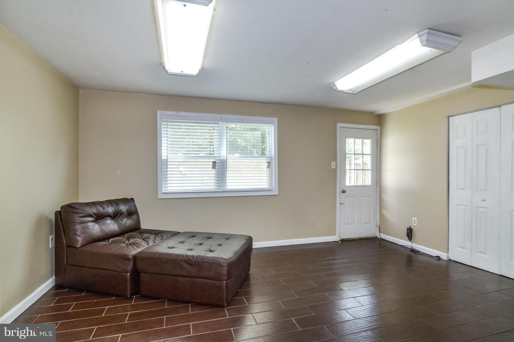 8609 Spring Creek Court Springfield, VA 22153 - Photo 17 of 30 a living room with furniture and a window