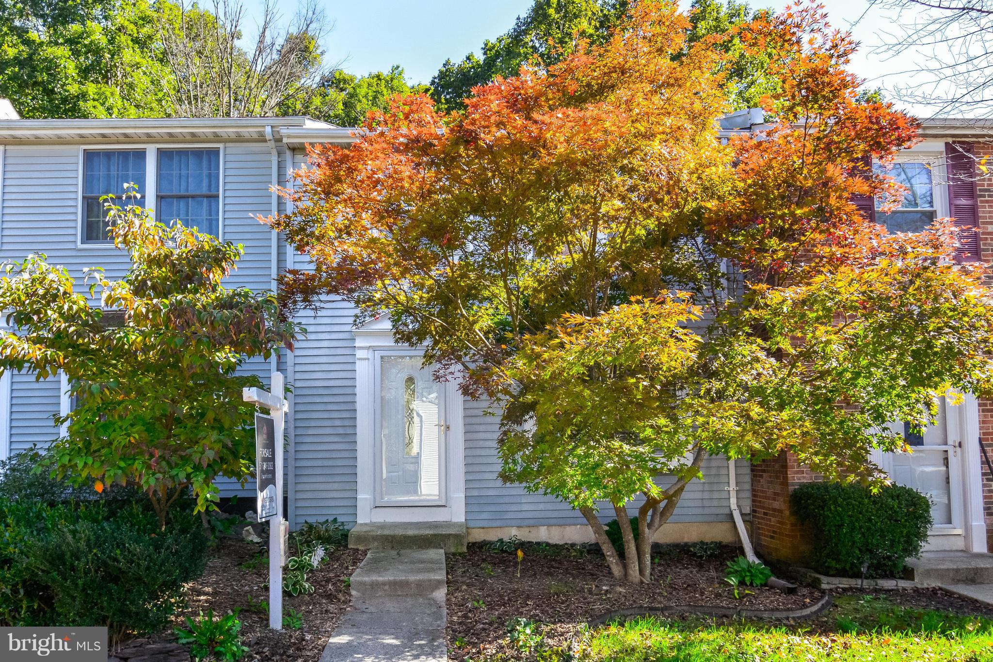 8609 Spring Creek Court Springfield, VA 22153 - Photo 23 of 30 a front view of a house with garden