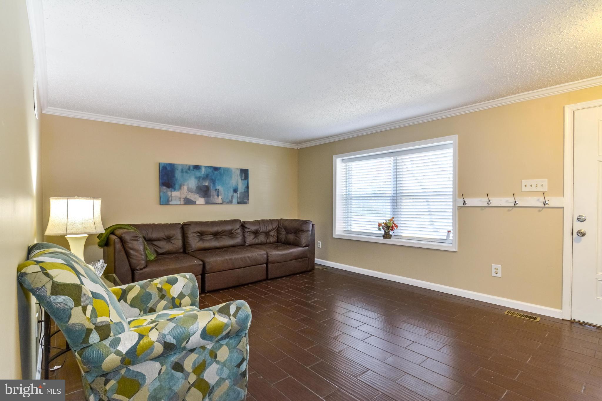 8609 Spring Creek Court Springfield, VA 22153 - Photo 27 of 30 a living room with furniture and a window