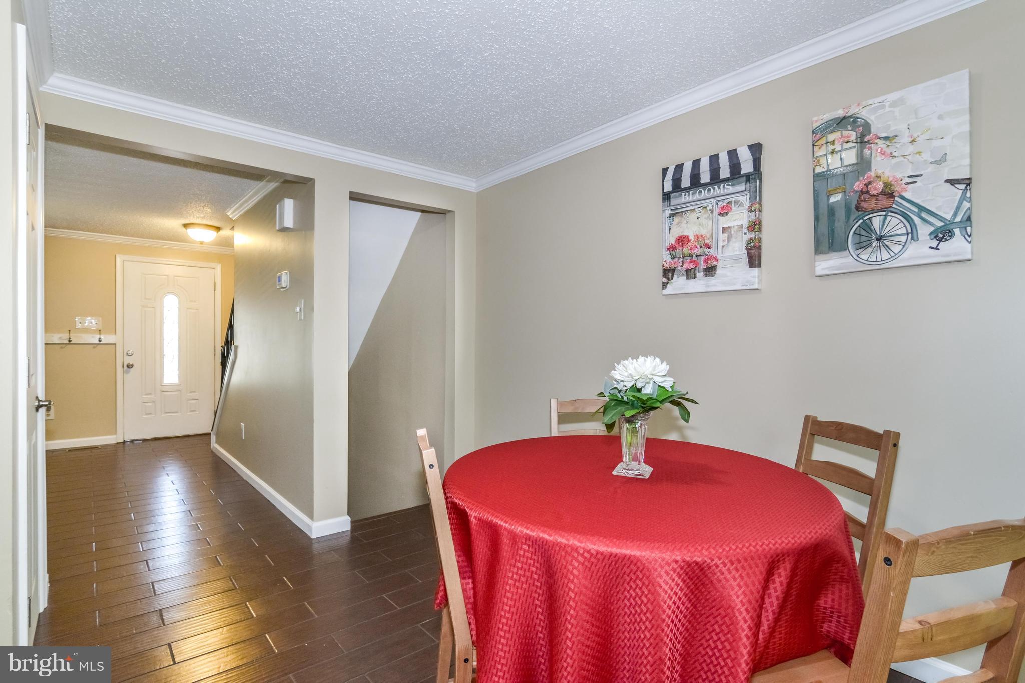8609 Spring Creek Court Springfield, VA 22153 - Photo 28 of 30 a dining room with furniture and wooden floor