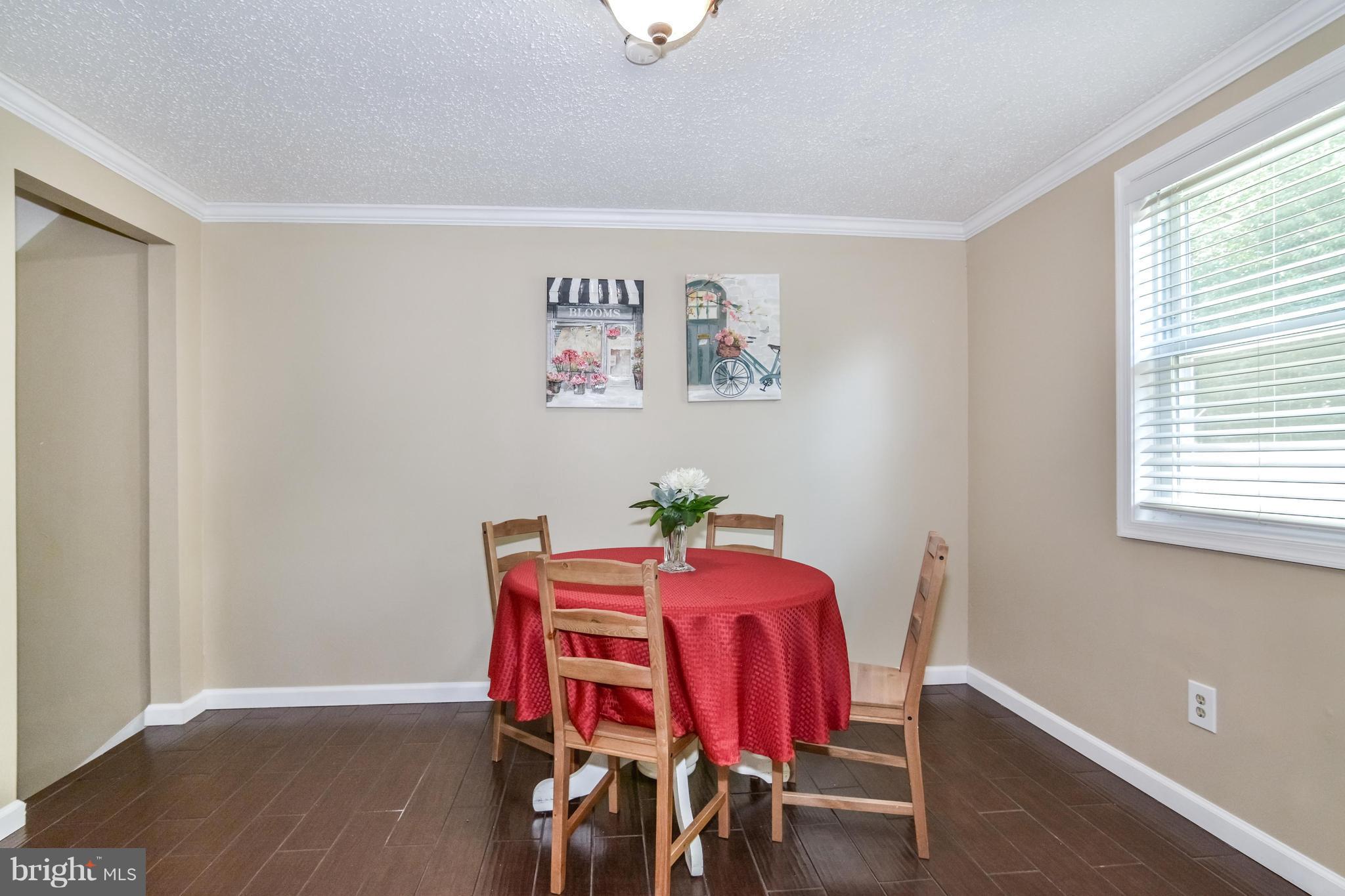 8609 Spring Creek Court Springfield, VA 22153 - Photo 29 of 30 a view of a room with a table and chairs
