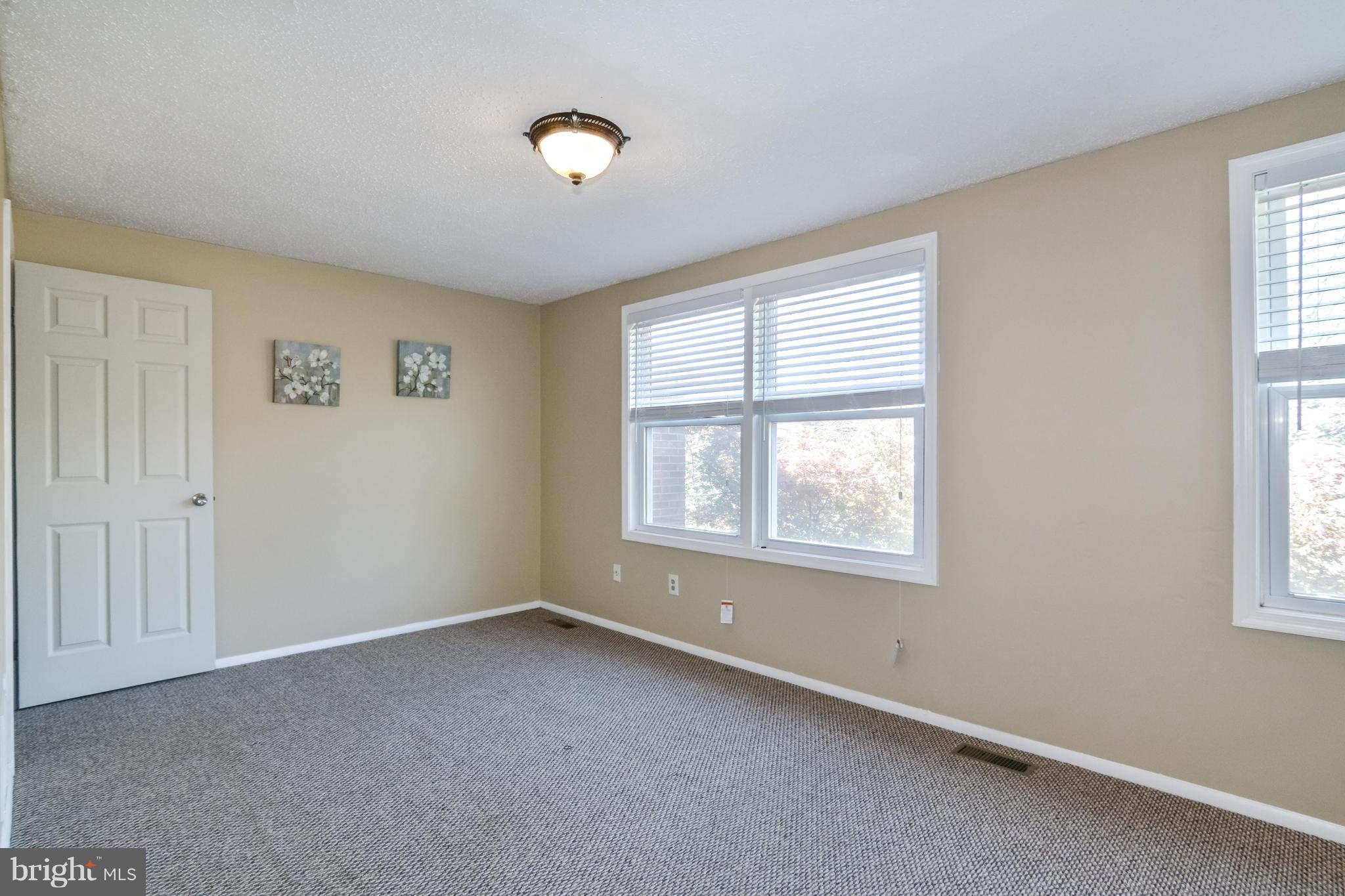 8609 Spring Creek Court Springfield, VA 22153 - Photo 7 of 30 an empty room with windows