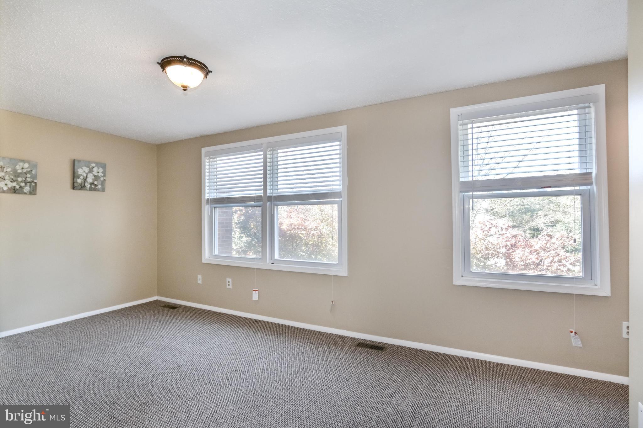 8609 Spring Creek Court Springfield, VA 22153 - Photo 8 of 30 an empty room with windows