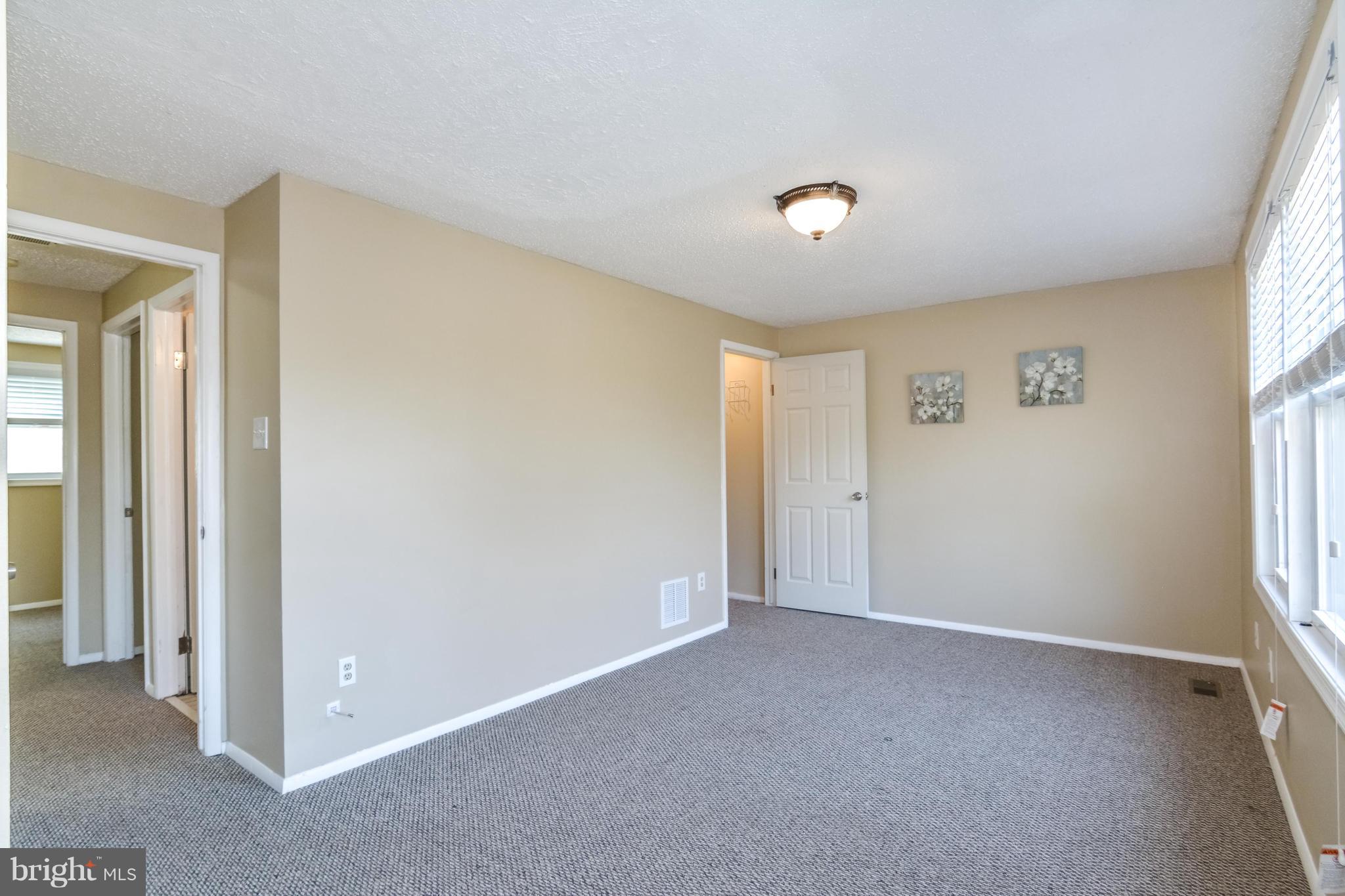 8609 Spring Creek Court Springfield, VA 22153 - Photo 10 of 30 a view of an empty room with a window