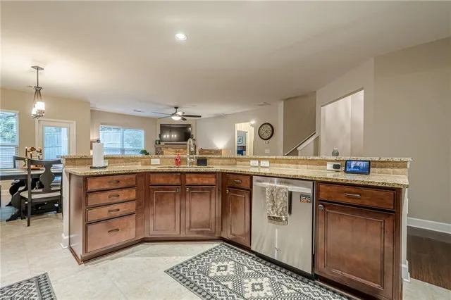 a view of a dining room with furniture and a chandelier