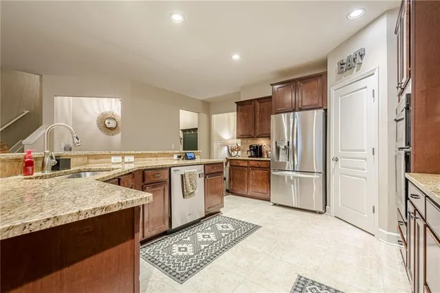 a view of a dining room with furniture and a chandelier