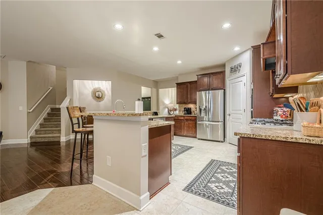 a living room with furniture fireplace and flat screen tv
