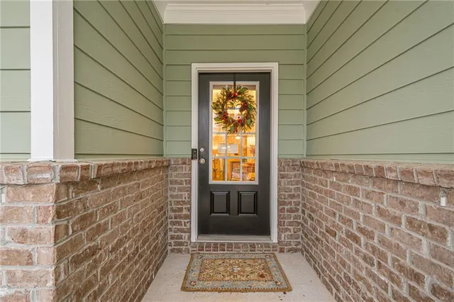 a view of entryway livingroom and hall with wooden floor