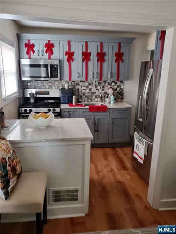 a room with furniture and a wooden floor