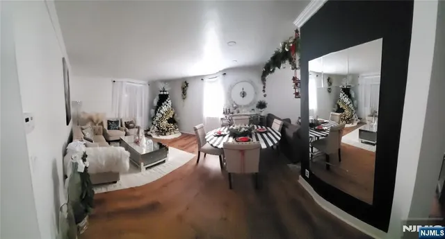 a living room with furniture and a glass door