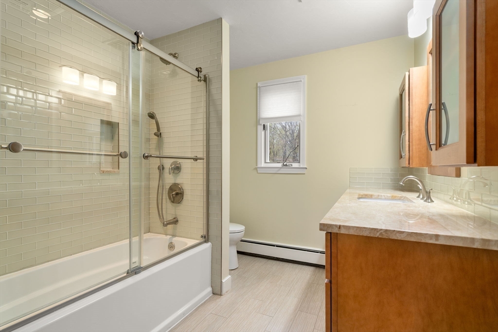 13 Lyndon Road Sharon, MA 02067 - Photo 27 of 29 a bathroom with a granite countertop sink mirror bathtub and shower