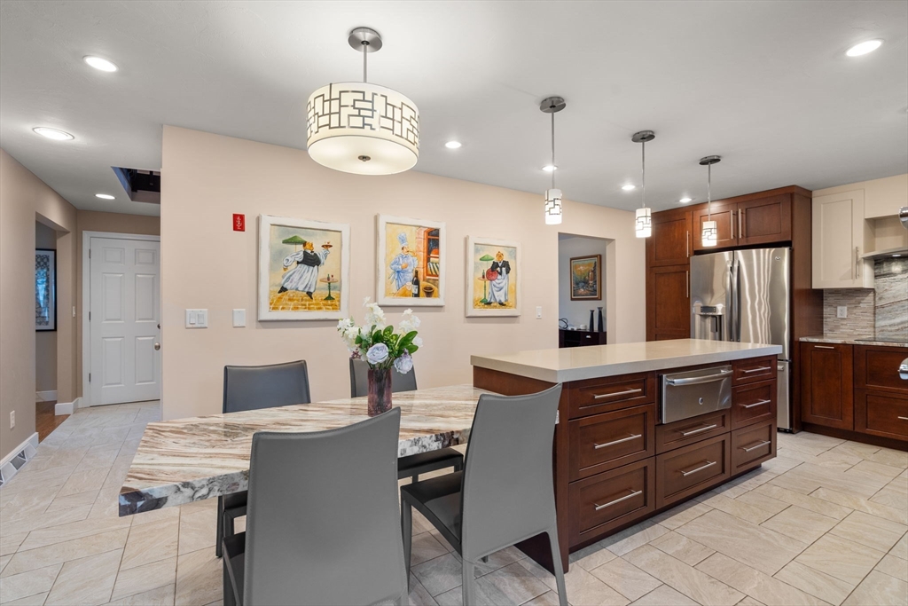 13 Lyndon Road Sharon, MA 02067 - Photo 8 of 29 a large kitchen with a table and chairs