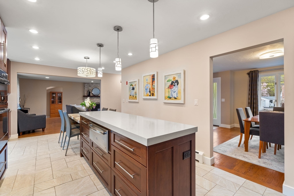 13 Lyndon Road Sharon, MA 02067 - Photo 9 of 29 an open kitchen with a table and chairs
