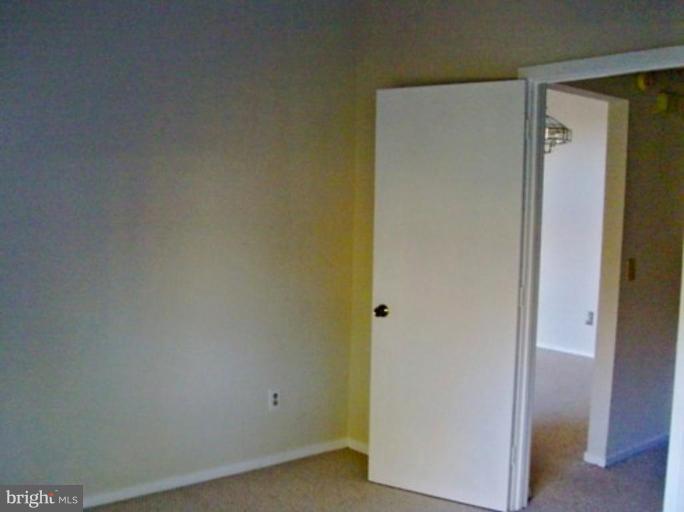 11703 Summerchase Circle, Unit E Reston, VA 20194 - Photo 5 of 6 a view of cupboard