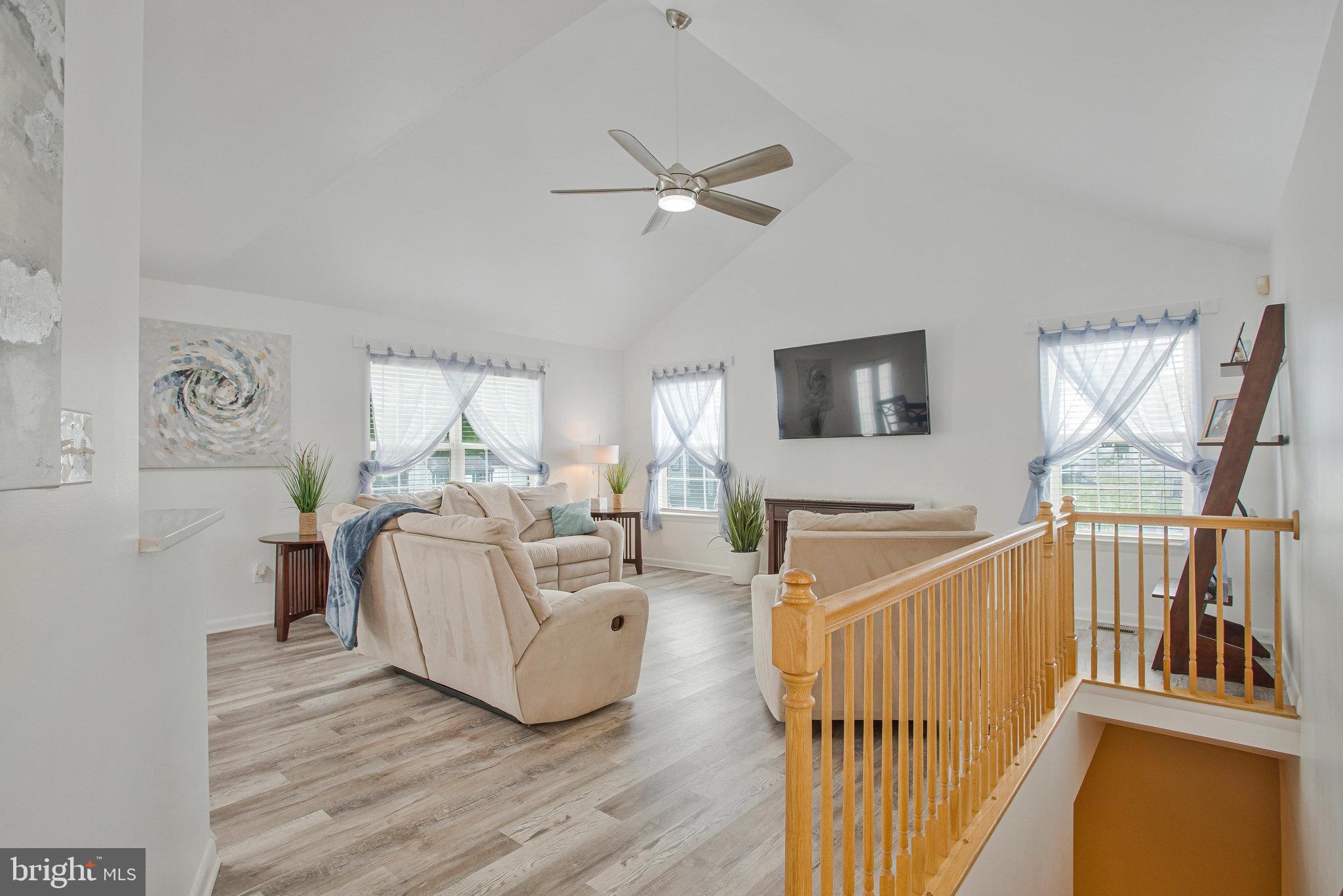 2345 Lowery Road Huntingtown, MD 20639 - Photo 6 of 24 a living room with furniture and a flat screen tv