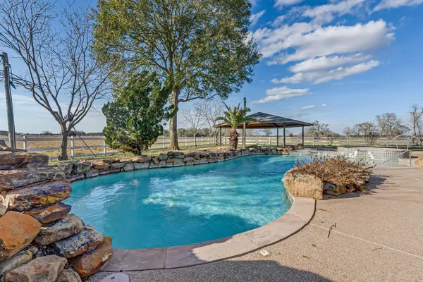 a view of a swimming pool with lounge chair