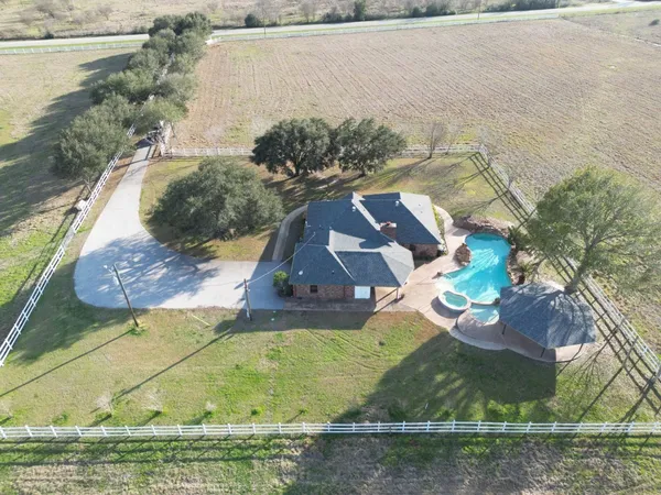 a view of swimming pool with a yard