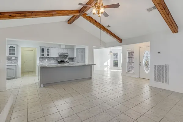 a view of a kitchen with a sink and cabinets