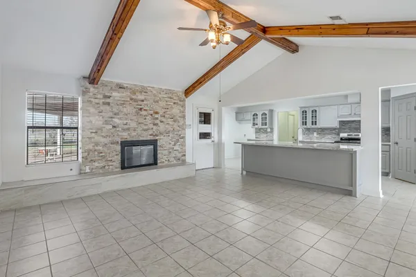 a view of a kitchen with furniture and a fireplace