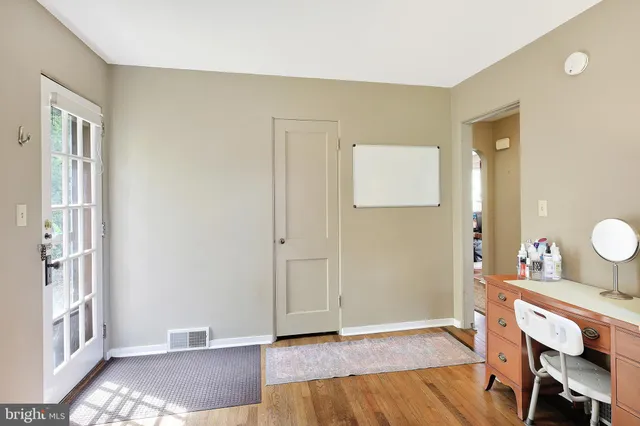 a view of a livingroom with furniture and wooden floor