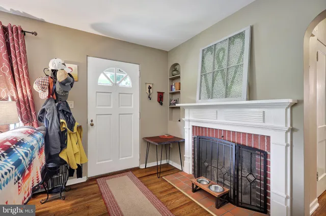 a view of a livingroom with furniture and a fireplace