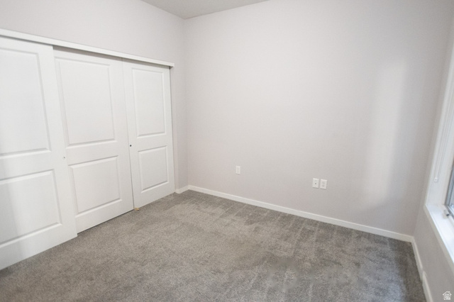 2150 South Main Street, Unit R405 Salt Lake City, UT 84115 - Photo 12 of 20 Room with light gray walls, gray carpet flooring, and white trim
