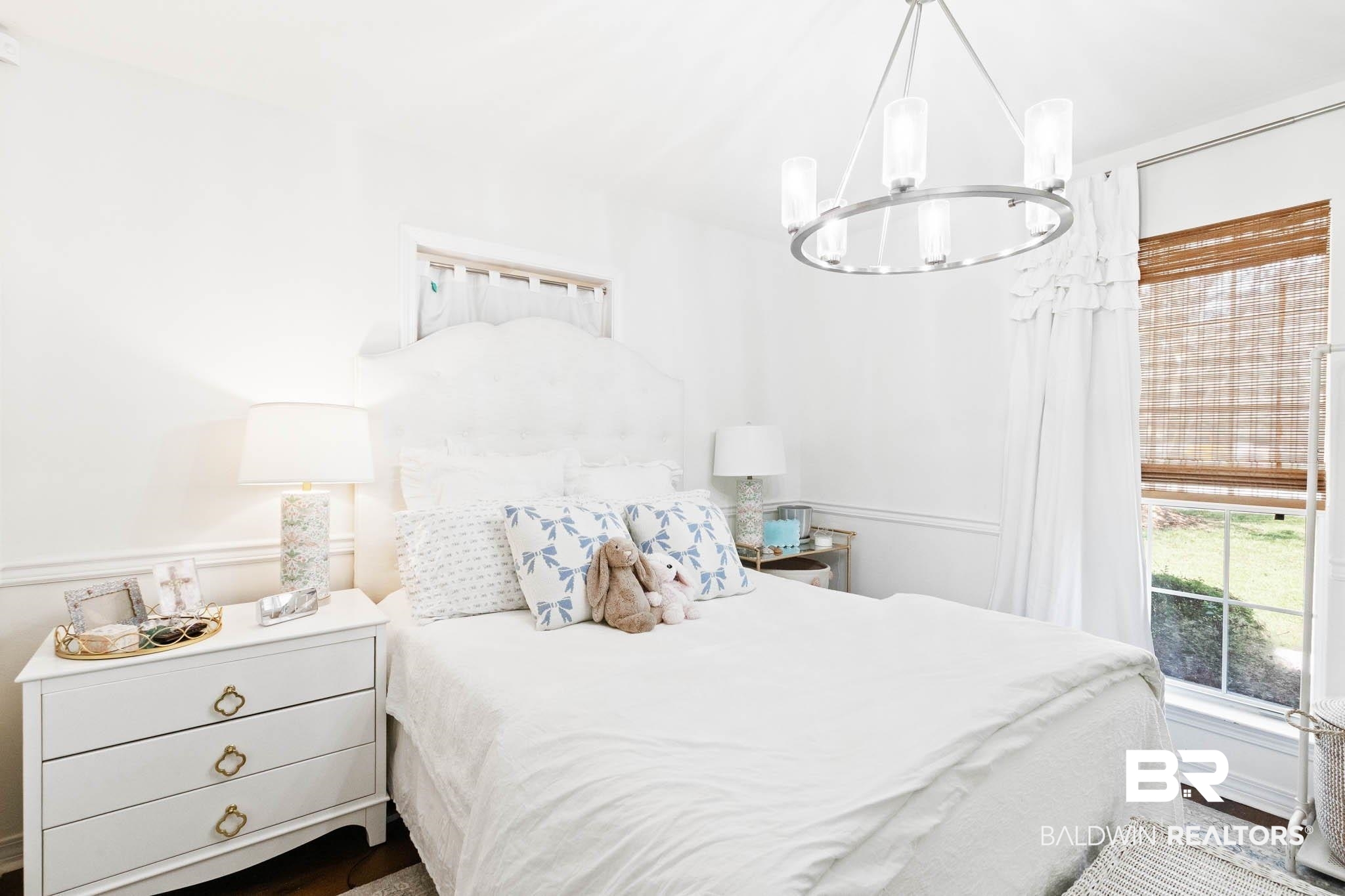 20685 Lowry Drive Fairhope, AL 36532 - Photo 35 of 48 Bedroom featuring a chandelier and wood finished floors