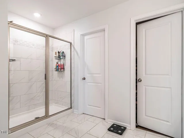 a bathroom with a double vanity sink mirror and