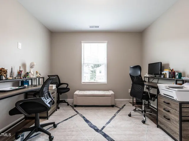 a bathroom with a double vanity sink mirror and next to a window