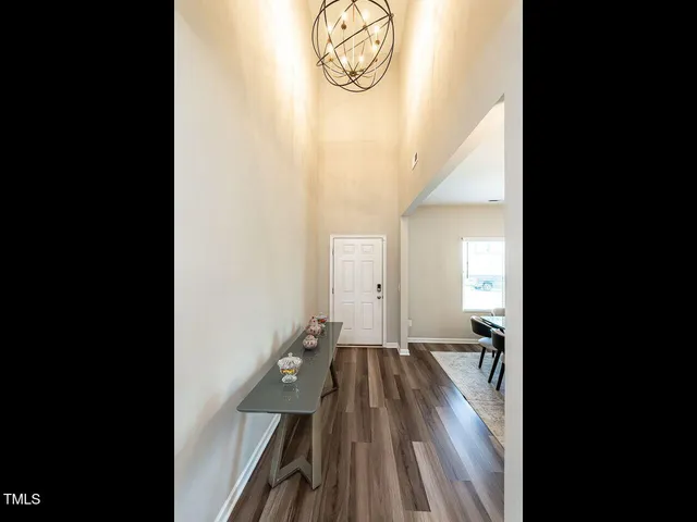 a front view of a house with plants