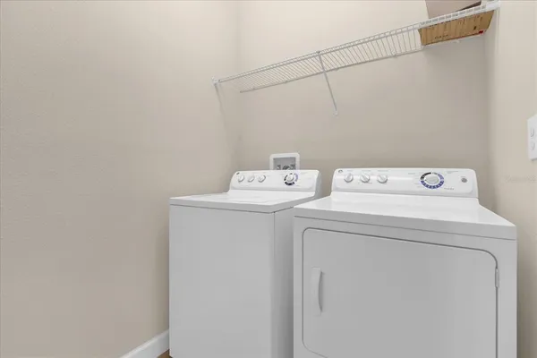 a utility room with dryer and washer