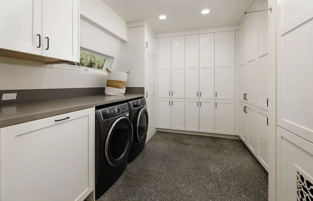 a view of a storage & utility room with washer and dryer