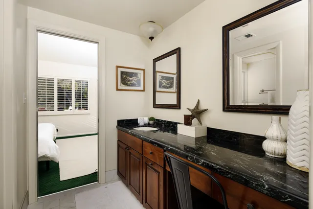 a kitchen with granite countertop a sink and a granite counter tops