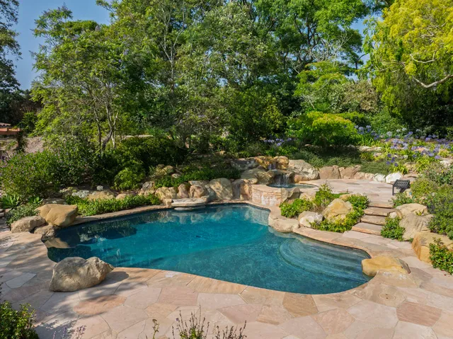 a view of a garden with a lake