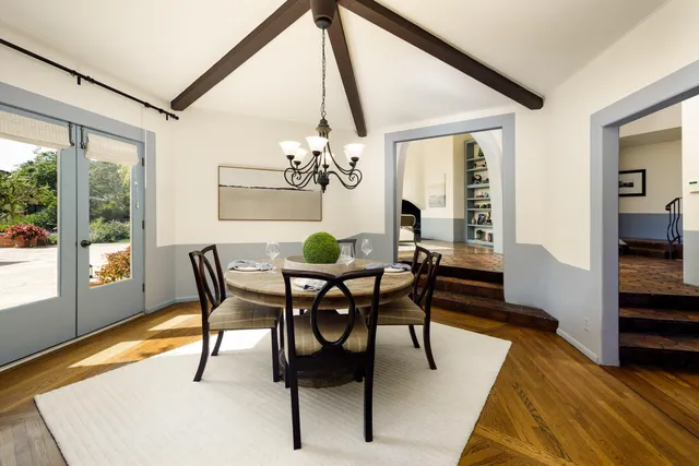a view of a dining room with furniture and window