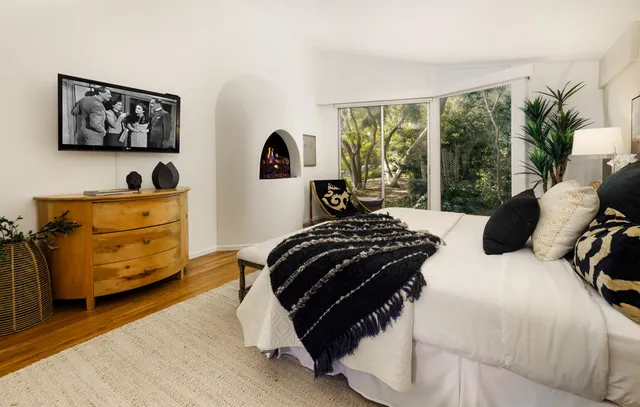 a bedroom with a bed and window