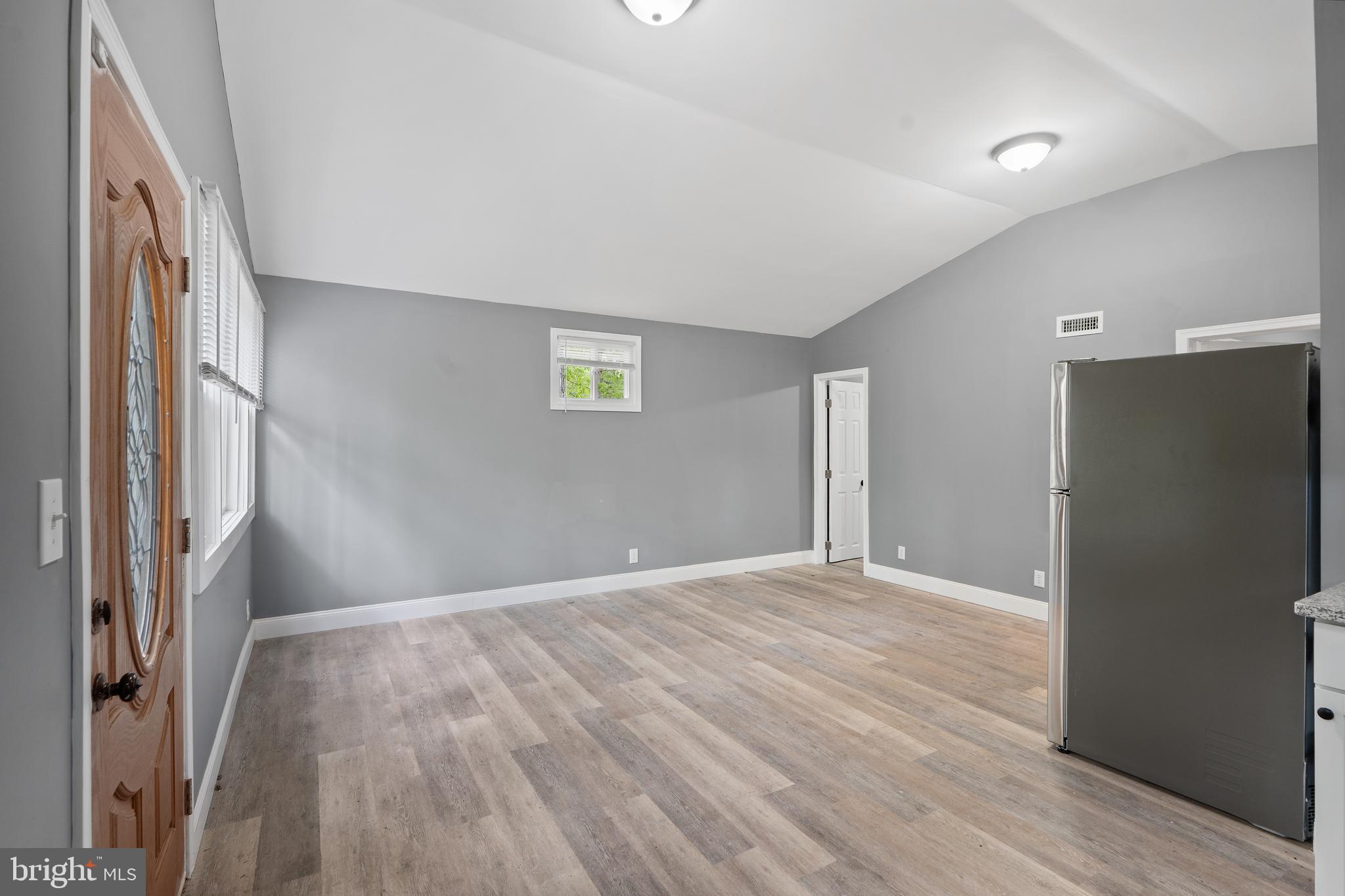 328 Jute Road Millville, NJ 08332 - Photo 11 of 28 a view of an empty room with wooden floor and a window