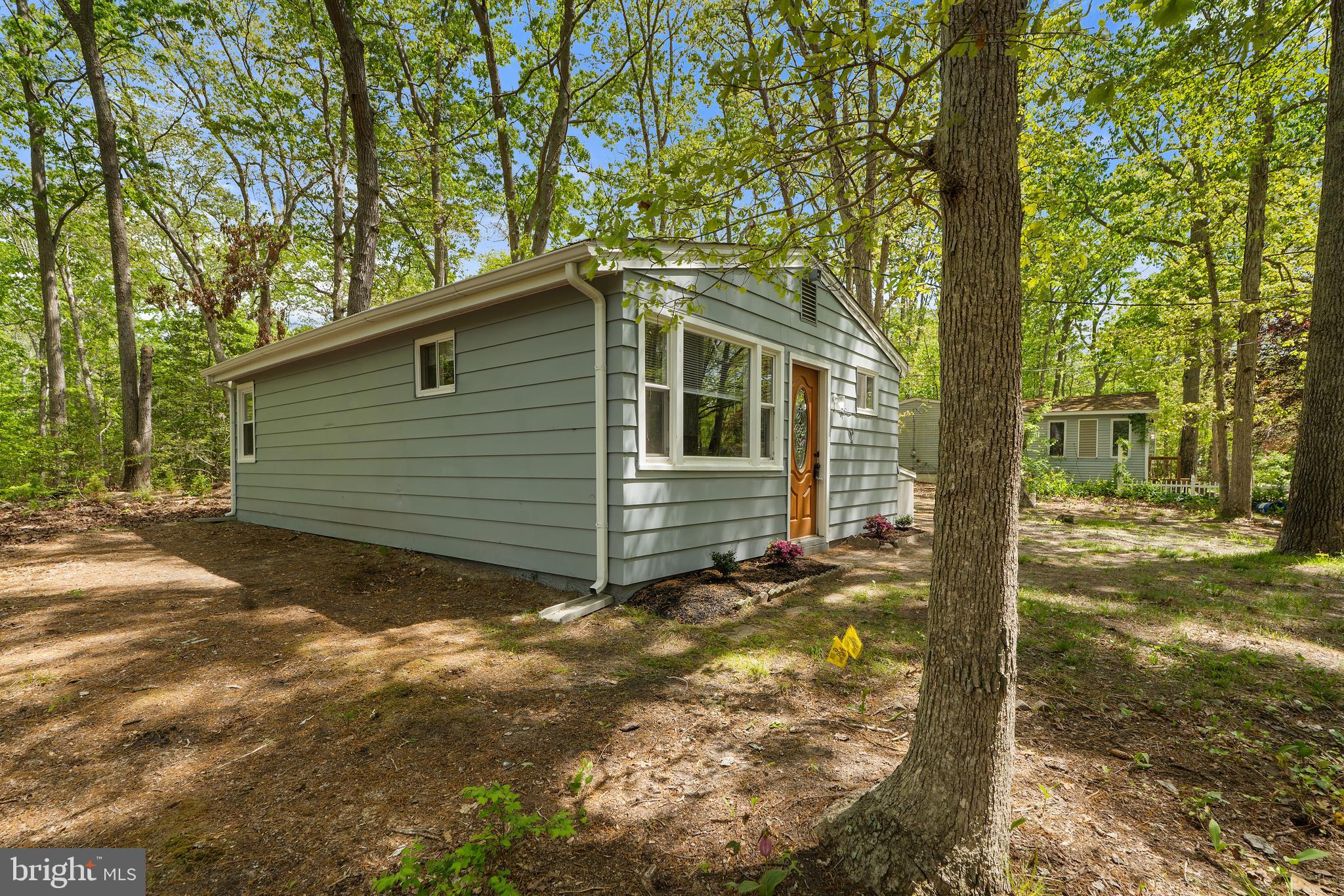 328 Jute Road Millville, NJ 08332 - Photo 3 of 28 a view of a house with backyard and trees