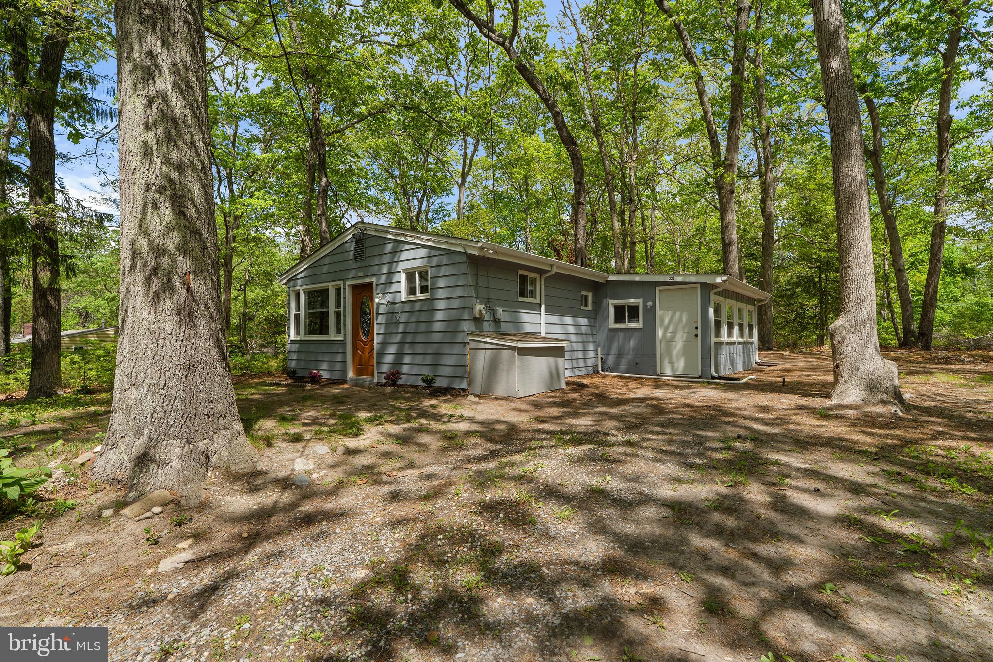 328 Jute Road Millville, NJ 08332 - Photo 4 of 28 a front view of a house with a garden