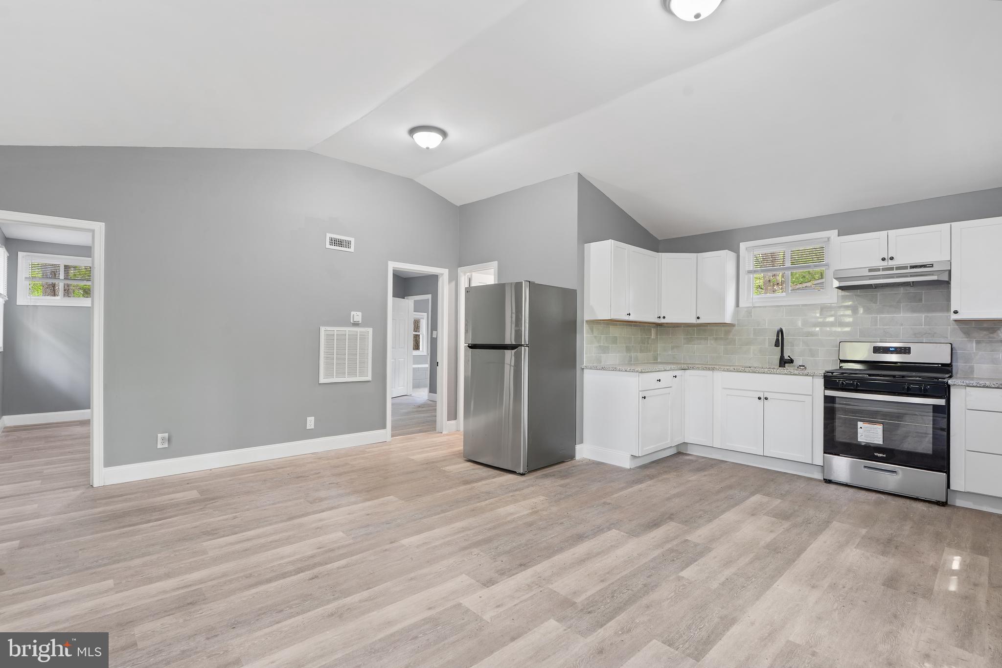 328 Jute Road Millville, NJ 08332 - Photo 5 of 28 a kitchen with stainless steel appliances a refrigerator and a stove top oven