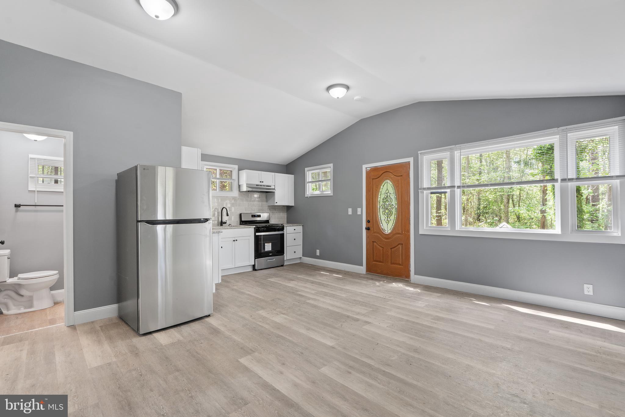 328 Jute Road Millville, NJ 08332 - Photo 6 of 28 a view of kitchen with stainless steel appliances wooden floor and chair