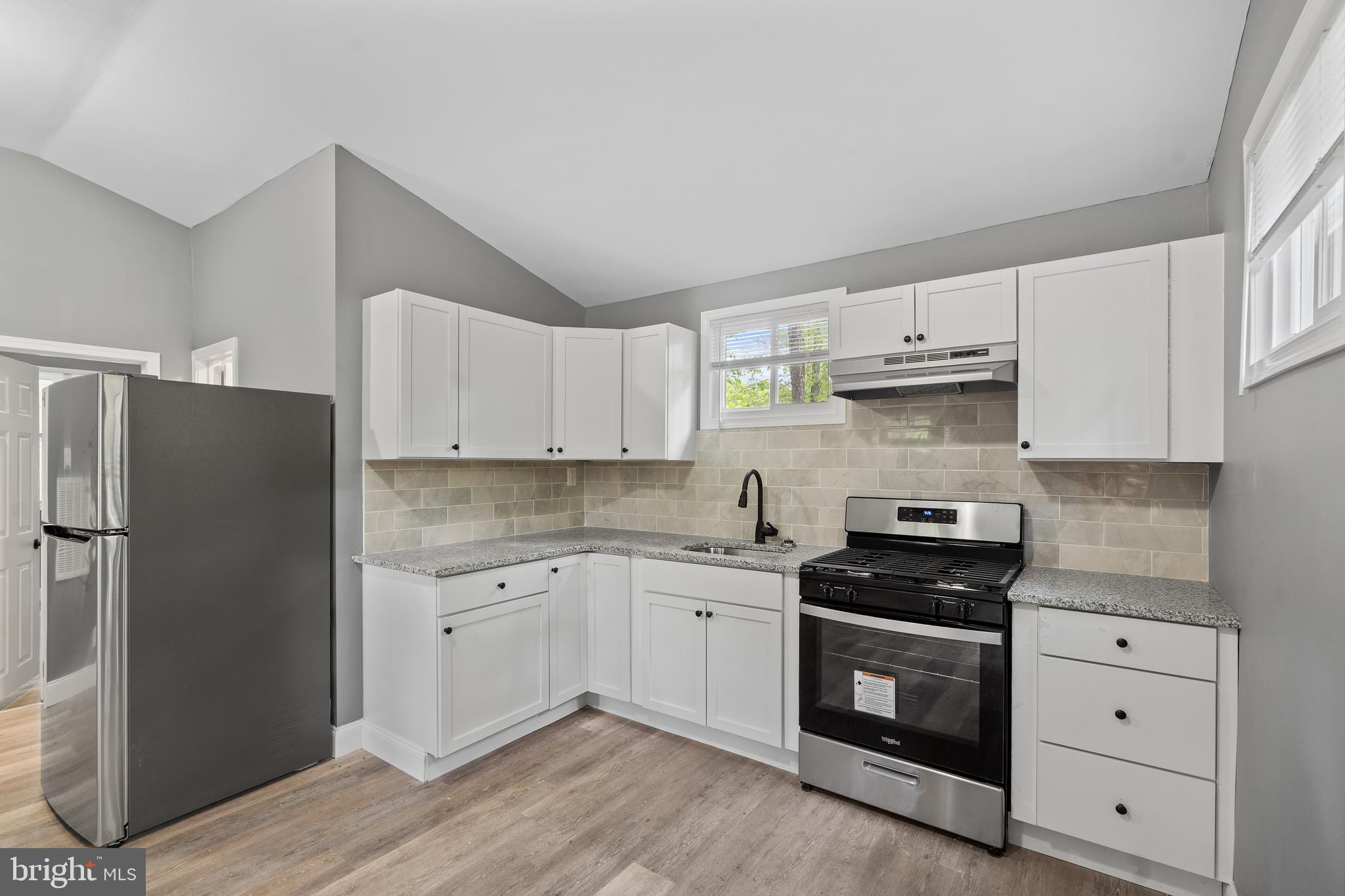 328 Jute Road Millville, NJ 08332 - Photo 8 of 28 a kitchen with stainless steel appliances white cabinets sink and a refrigerator