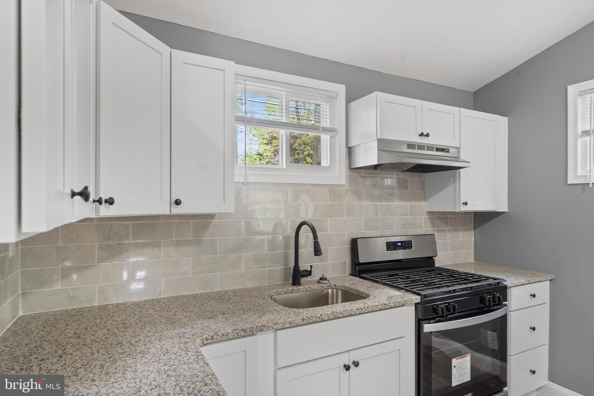 328 Jute Road Millville, NJ 08332 - Photo 10 of 28 a kitchen with stainless steel appliances granite countertop a sink stove and cabinets