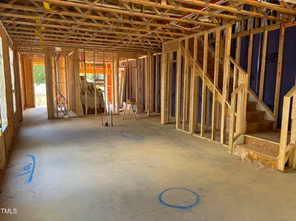 a view of an empty room with windows