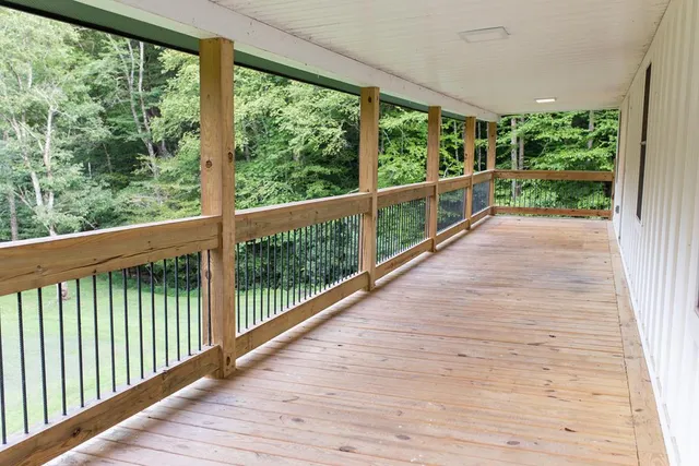 a view of a balcony with wooden floor