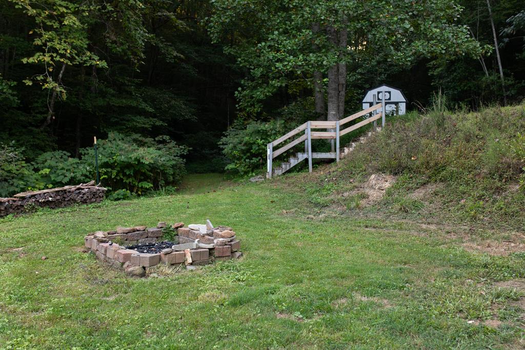 1146 Galloway Road Blue Ridge, GA 30513 - Photo 33 of 33 a view of a two chairs in a backyard