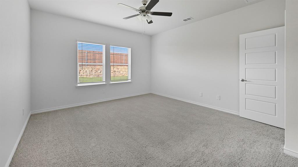 3421 Amaretto Road Aubrey, TX 76227 - Photo 11 of 38 an empty room with a window